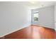 Bright bedroom with hardwood flooring and a window bringing in natural light at 12997 Bartlett Dr, Fishers, IN 46037