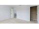Carpeted bedroom featuring a closet, and a view of another room through an open doorway at 12997 Bartlett Dr, Fishers, IN 46037