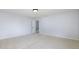 Empty bedroom with neutral walls, carpeted floor, and a walk-in closet at 12997 Bartlett Dr, Fishers, IN 46037