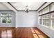 Bright dining room with hardwood flooring, neutral walls, and large windows at 12997 Bartlett Dr, Fishers, IN 46037