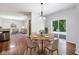 Cozy dining room with hardwood floors adjacent to the living room; lots of light at 12997 Bartlett Dr, Fishers, IN 46037