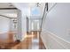Inviting foyer featuring gleaming hardwood floors, a staircase, and ample natural light at 12997 Bartlett Dr, Fishers, IN 46037