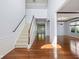 Open foyer showcases hardwood floors and staircase leading to the upper level at 12997 Bartlett Dr, Fishers, IN 46037