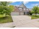 Traditional two-story brick home with a well-manicured front yard at 12997 Bartlett Dr, Fishers, IN 46037