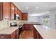 Updated kitchen featuring stainless appliances, light countertops, backsplash, and an island with storage at 12997 Bartlett Dr, Fishers, IN 46037