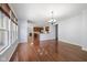 Open floor plan with wood floors and a view of the kitchen at 12997 Bartlett Dr, Fishers, IN 46037