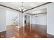 Open-concept living space with hardwood floors, staircase, and plenty of natural light at 12997 Bartlett Dr, Fishers, IN 46037
