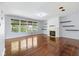 Bright living room with fireplace, hardwood floors, and lots of natural light at 12997 Bartlett Dr, Fishers, IN 46037