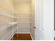 Walk-in pantry with wire shelving providing ample storage next to a door at 12997 Bartlett Dr, Fishers, IN 46037