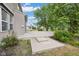 Large concrete patio with steps leading to a spacious yard, perfect for outdoor entertaining and relaxation at 12997 Bartlett Dr, Fishers, IN 46037