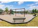 Neighborhood playground featuring swings, slides, and a bench at 12997 Bartlett Dr, Fishers, IN 46037