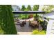 Aerial view of beautiful outdoor living space and patio featuring dining area and fire pit at 12998 Silbury Hill Way, Fishers, IN 46037