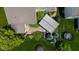 Aerial view of the backyard shows a pergola, a stone patio, lush greenery, and a trampoline in a well-maintained lawn at 12998 Silbury Hill Way, Fishers, IN 46037