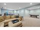 Finished basement with neutral carpet, light blue walls, and ample space for activities at 12998 Silbury Hill Way, Fishers, IN 46037