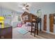 bedroom featuring a unique bunk bed with built-in playhouse, bookshelf, and a desk at 12998 Silbury Hill Way, Fishers, IN 46037