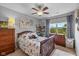 Cozy bedroom featuring a toddler bed with stuffed animals, a dresser, and a window with natural light at 12998 Silbury Hill Way, Fishers, IN 46037