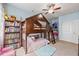 Fun bedroom featuring a unique bunk bed with built-in playhouse, bookshelf, and a desk at 12998 Silbury Hill Way, Fishers, IN 46037