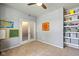 Versatile room with neutral walls, carpet, and a built-in shelf, ideal for a home office or playroom at 12998 Silbury Hill Way, Fishers, IN 46037