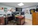 This dedicated home office provides an ideal workspace with custom desk and natural light at 12998 Silbury Hill Way, Fishers, IN 46037