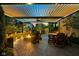 Inviting outdoor patio features a pergola, fire pit, and comfortable seating for entertaining guests at 12998 Silbury Hill Way, Fishers, IN 46037