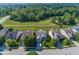Aerial view of homes with golf course views, surrounded by lush greenery in a suburban setting at 13161 Duval Dr, Fishers, IN 46037