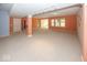 Expansive basement area with neutral carpeting and abundant space for versatile living arrangements at 13161 Duval Dr, Fishers, IN 46037