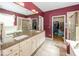 Bathroom features a double sink vanity, walk-in closet, and tiled floors at 13161 Duval Dr, Fishers, IN 46037