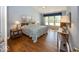 Bedroom featuring hardwood floors, large windows, and blue walls at 13161 Duval Dr, Fishers, IN 46037