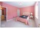 Cozy bedroom featuring pink walls, a single bed, and access to an ensuite bathroom at 13161 Duval Dr, Fishers, IN 46037