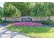 Beautiful Gray Eagle neighborhood entrance sign surrounded by lush landscaping and colorful flowers at 13161 Duval Dr, Fishers, IN 46037