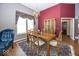 Elegant dining room featuring hardwood floors, a chandelier, and stylish decor at 13161 Duval Dr, Fishers, IN 46037