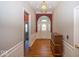 Inviting foyer with hardwood floors, decorative chandelier, and elegant wainscoting at 13161 Duval Dr, Fishers, IN 46037