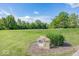 Scenic view of the golf course, hole 12, with manicured green and surrounding trees at 13161 Duval Dr, Fishers, IN 46037