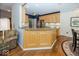 Open kitchen featuring wood cabinets, granite counters, a breakfast bar, and stainless steel appliances at 13161 Duval Dr, Fishers, IN 46037