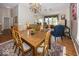 Open-concept living and dining area with hardwood floors, a chandelier, and stylish furnishings at 13161 Duval Dr, Fishers, IN 46037