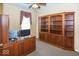 Bright office features built-in shelves, wood trim, and large desk area at 13161 Duval Dr, Fishers, IN 46037