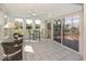 Enclosed sunroom with lots of windows that allow natural light in plus views of the outdoor deck at 13161 Duval Dr, Fishers, IN 46037