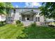 Spacious backyard featuring a covered patio with outdoor furniture and well-maintained lawn at 1319 Gable Lake Dr, Brownsburg, IN 46112