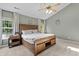 Bright and spacious bedroom with a vaulted ceiling, ceiling fan, and natural light from windows with decorative curtains at 1319 Gable Lake Dr, Brownsburg, IN 46112