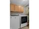 Functional laundry room featuring modern appliances and ample cabinet space for storage of laundry essentials at 1319 Gable Lake Dr, Brownsburg, IN 46112