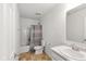 Bathroom with shower-tub combo, white vanity, and modern fixtures at 1338 Delacorte Cir, Shelbyville, IN 46176