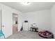 Well-lit bedroom with neutral walls and carpet, includes a dresser and some toys at 1338 Delacorte Cir, Shelbyville, IN 46176