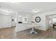 Inviting dining room with modern table, wood floors, neutral walls, and open view to living area at 1338 Delacorte Cir, Shelbyville, IN 46176
