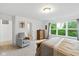 Main bedroom offers natural light, neutral paint, and chair in corner at 1338 Delacorte Cir, Shelbyville, IN 46176