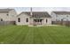 Large backyard with a well-maintained lawn, gazebo, and fire pit at 14332 Eddington Pl, Fishers, IN 46037