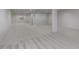 Finished basement with neutral carpet, recessed lights, and a support beam at 14332 Eddington Pl, Fishers, IN 46037