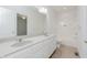 Bathroom featuring double sinks, spacious countertops, and a separate tub and shower area at 14332 Eddington Pl, Fishers, IN 46037