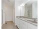 Bathroom features double vanity with granite countertop, tiled floors, and glass enclosed shower at 14332 Eddington Pl, Fishers, IN 46037