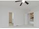 Bedroom boasts neutral carpet and ceiling fan, with entrances to bathroom and another room at 14332 Eddington Pl, Fishers, IN 46037