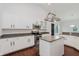 Modern kitchen with white cabinets, granite countertops, stainless steel appliances, and a functional center island at 14332 Eddington Pl, Fishers, IN 46037